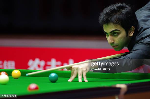 Pankaj Advani of Indian plays a shot in quarter-finals match against Luca Brecel of Belgium on day six of Snooker World Cup 2015 at Wuxi Stadium on...
