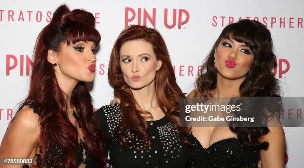 Singer Lisa Marie, model and television personality Holly Madison and model Claire Sinclair joke around as they arrive at the anniversary celebration...