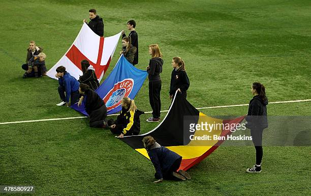 Flag bearers during a U16 International match between England and Belgium at St Georges Park on February 14, 2014 in Burton-upon-Trent, England.