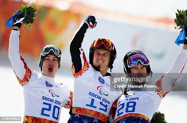 Evan Strong of the United States celebrates winning the gold medal with silver medalist Michael Shea of the United States and bronze medalist Keith...