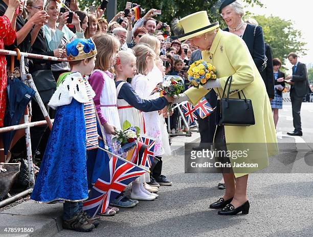 Queen Elizabeth II meets German children including Konrad Thelen aged 5 as she departs the Adlon Hotel on the final day of a four day State Visit to...