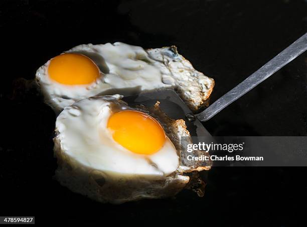 Two Bright Orange And White Eggs Fry Up High-Res Stock Photo