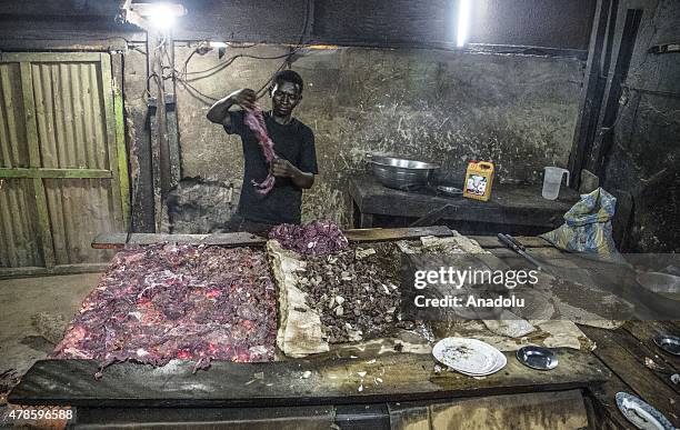 Worker makes camel meat kabab in the capital N'djamena, Chad on June 22, 2015. Around %85 of the people of Chad, referred to as the "Dead Heart of...