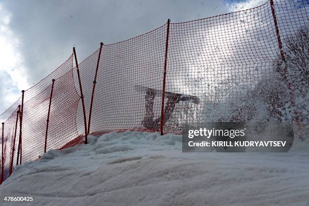 Finland's Matti Suur-Hamari crashes while competing in the Men's Snowboard Standing during the XI Paralympic Olympic games at the Rosa Khutor Alpine...