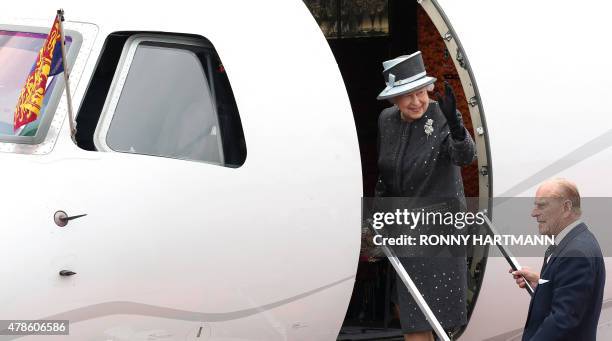 Britain's Queen Elizabeth II and The Duke of Edinburg, Prince Philip board a plane at the military airport in Celle to fly back to London on June 26,...