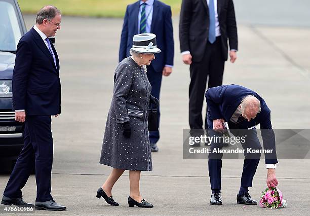 Prime Minister of the state of Lower Saxony Stephan Weil , Queen Elizabeth II and Prince Philip, Duke of Edinburgh, arrive at the military airport of...