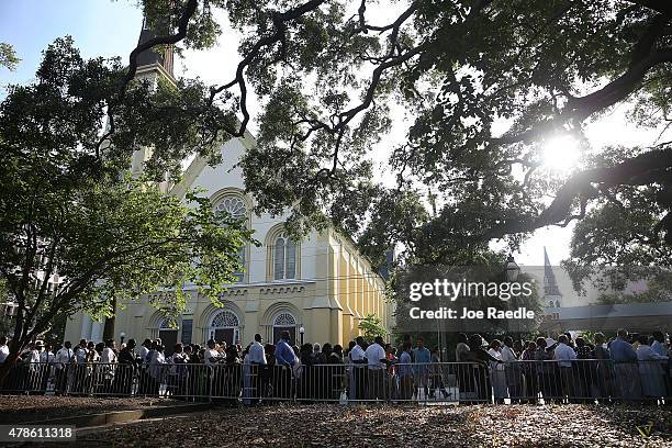 People line up to enter the College Charleston TD Arena where President Barack Obama is scheduled to deliver the eulogy for South Carolina State Sen....