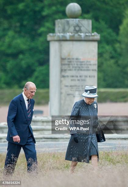 Queen Elizabeth II and Prince Philip, Duke of Edinburgh visit the concentration camp memorial at Bergen-Belsen on June 26, 2015 in Lohheide, Germany....