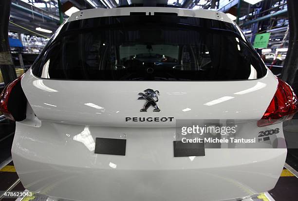 Peugeot 2008 SUVs at the PSA Peugeot Citroen assembly plant on March 14, 2014 in Mulhouse, France. Chinese automaker Dongfeng is scheduled to soon...