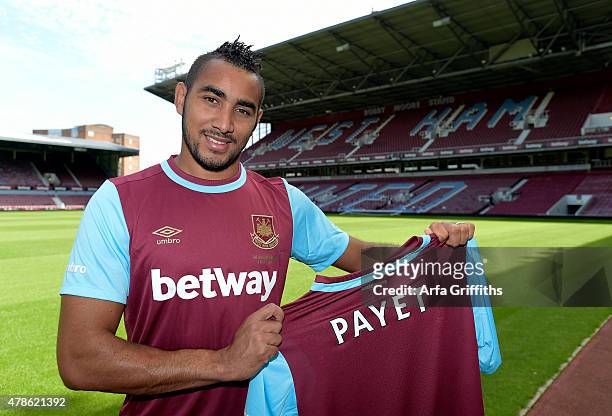 Dimitri Payet poses after signing for West Ham United at Upton Park on June 26, 2015 in London, England.