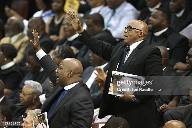 Mourners attend the funeral at the College Charleston TD Arena where President Barack Obama is scheduled to deliver the eulogy for South Carolina...