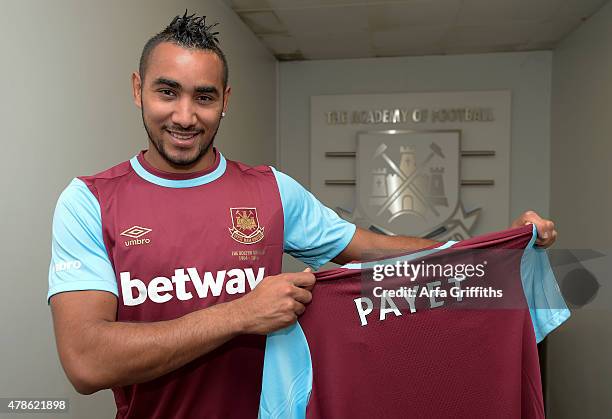 Dimitri Payet poses after signing for West Ham United at Upton Park on June 26, 2015 in London, England.