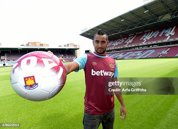 Dimitri Payet poses after signing for West Ham United at Upton Park on June 26, 2015 in London, England.