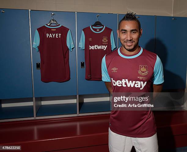 Dimitri Payet poses after signing for West Ham United at Upton Park on June 26, 2015 in London, England.