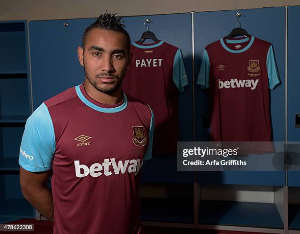 Dimitri Payet poses after signing for West Ham United at Upton Park on June 26, 2015 in London, England.