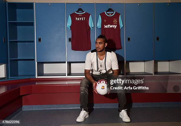 Dimitri Payet poses after signing for West Ham United at Upton Park on June 26, 2015 in London, England.