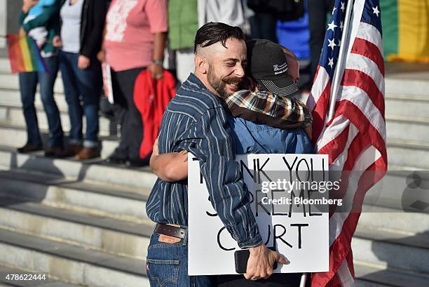 Demonstrators in support of same-sex marriage embrace after the U.S. Supreme Court ruling in San Francisco, California, U.S., on Friday, June 26,...