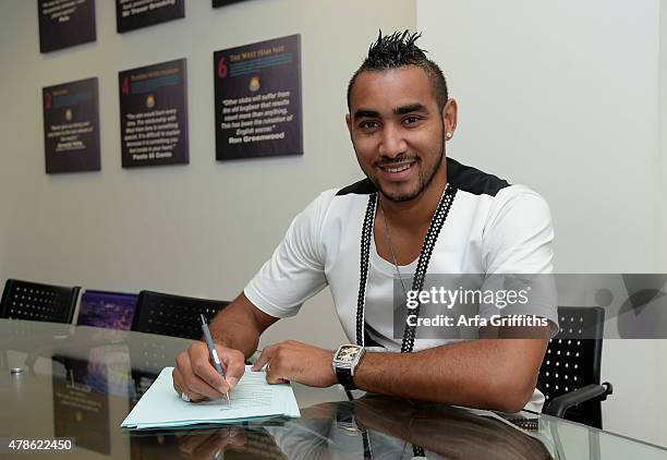 Dimitri Payet poses after signing for West Ham United at Upton Park on June 26, 2015 in London, England.