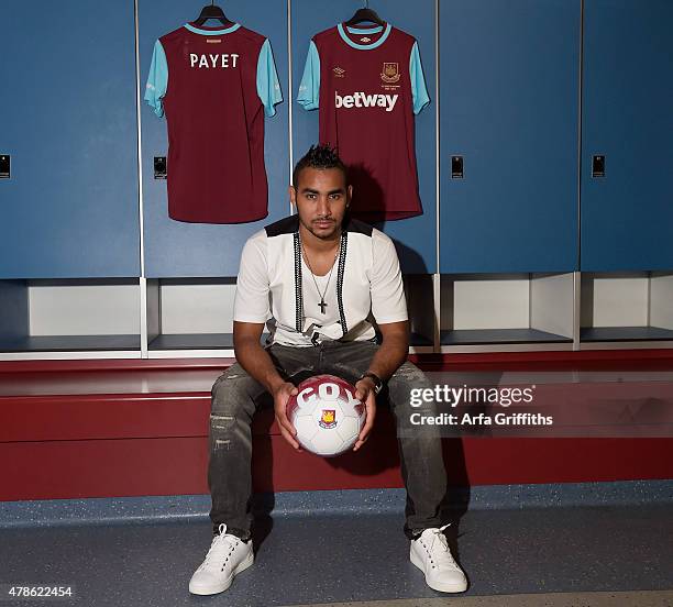 Dimitri Payet poses after signing for West Ham United at Upton Park on June 26, 2015 in London, England.