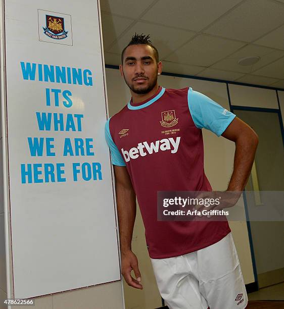 Dimitri Payet poses after signing for West Ham United at Upton Park on June 26, 2015 in London, England.