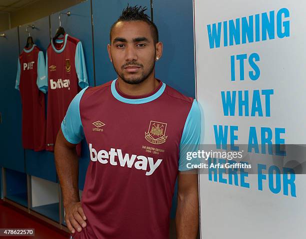 Dimitri Payet poses after signing for West Ham United at Upton Park on June 26, 2015 in London, England.