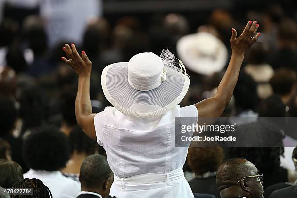 Mourners attend the funeral at the College Charleston TD Arena where President Barack Obama is scheduled to deliver the eulogy for South Carolina...