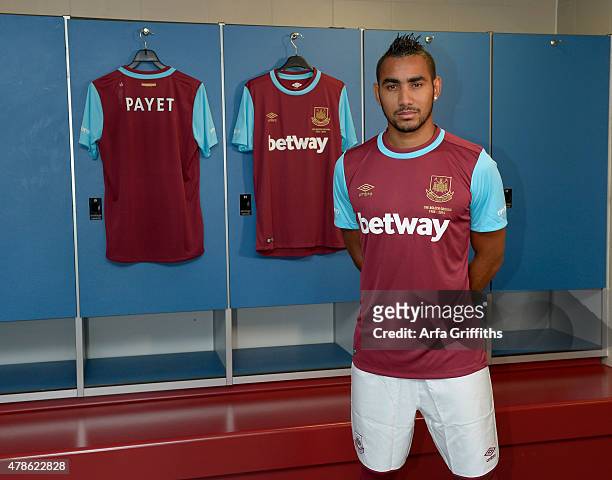Dimitri Payet poses after signing for West Ham United at Upton Park on June 26, 2015 in London, England.