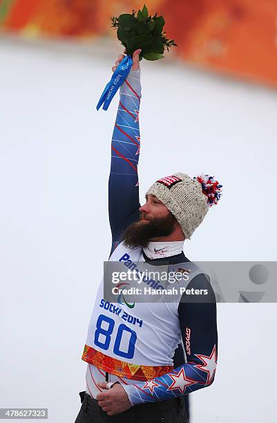 Silver medalist Heath Calhoun of the United States celebrates during the flower ceremony in the Men's Super Combined Sitting Super G on day seven of...