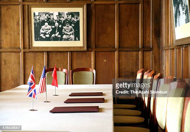 Flags of the United Kingdom, the United States and the Soviet Union are placed on the table of the room where the leaders signed the documents during...