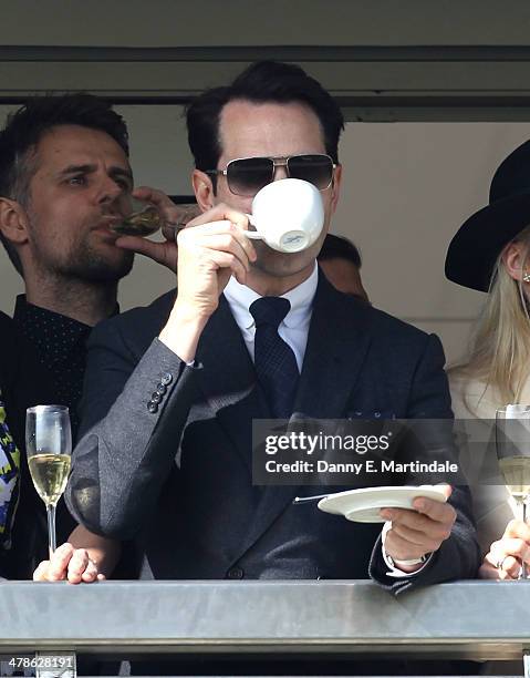 Jimmy Carr watch the raciong on day 4 of The Cheltenham Festival at Cheltenham Racecourse on March 14, 2014 in Cheltenham, England.