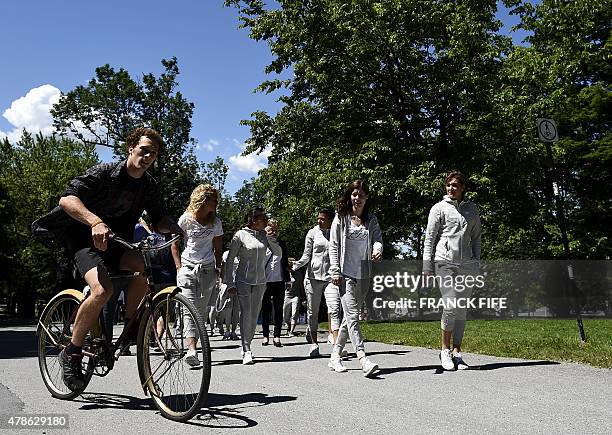 France's midfielder Kheira Hamraoui, midfielder Kenza Dali, defender Annaig Butel and midfielder Claire Lavogez walk at Mount Royal Park before the...