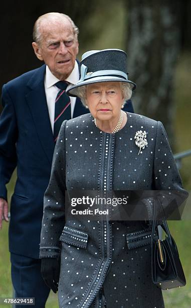 Queen Elizabeth II and Prince Philip, Duke of Edinburgh visit the concentration camp memorial at Bergen-Belsen on June 26, 2015 in Lohheide, Germany....