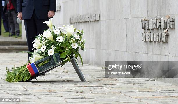 Queen Elizabeth II and Prince Philip, Duke of Edinburgh have laid a wreath at the inscription wall during their visit of the concentration camp...