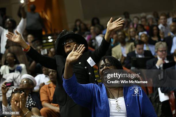 Mourners sing gospel hymns during the funeral service where U.S. President Barack Obama will deliver the eulogy for South Carolina State senator and...