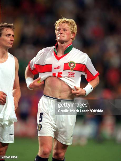 June 1998 - Football World Cup 1998 - Scotland v Morocco - Colin Hendry of Scotland wears a Morocco shirt after swapping at the end of the match.