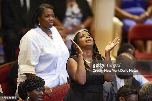 Mourners react at a funeral for Ethel Lance at Royal Missionary Baptist Church on Thursday, June 25, 2015 in North Charleston, S.C. Lance and eight...