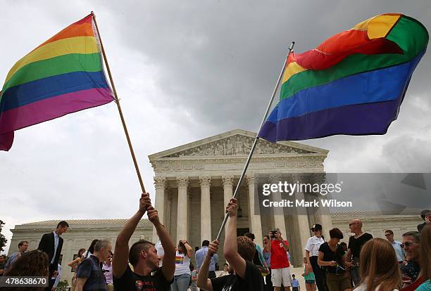 People celebrate in front of the U.S. Supreme Court after the ruling in favor of same-sex marriage June 26, 2015 in Washington, DC. The high court...