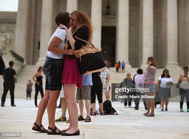 Arielle Cronig and Elaine Cleary embrace outside of the U.S. Supreme Court after the ruling in favor of same-sex marriage June 26, 2015 in...
