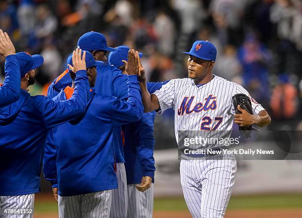 New York Mets relief pitcher Jeurys Familia high fives teammates at games end. New York Mets vs Philadelphia Phillies @ Citifield. Tuesday, April 14,...