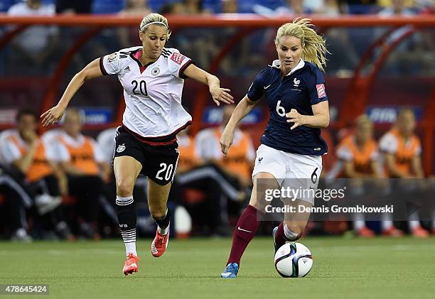 Lena Goessling of Germany chases Amandine Henry of France during the FIFA Women's World Cup Canada 2015 Quarter Final match between Germany and...