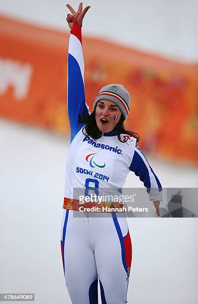 Gold medalist Marie Bochet of France celebrates during the flower ceremony for the Women's Super Combined Standing Super G during day seven of the...
