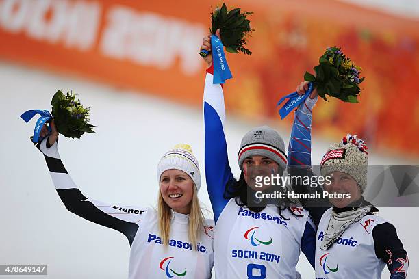 Gold medalist Marie Bochet of France poses with silver medalist Andrea Rothfuss of Germany and bronze medalist Stephanie Jallen of the United States...