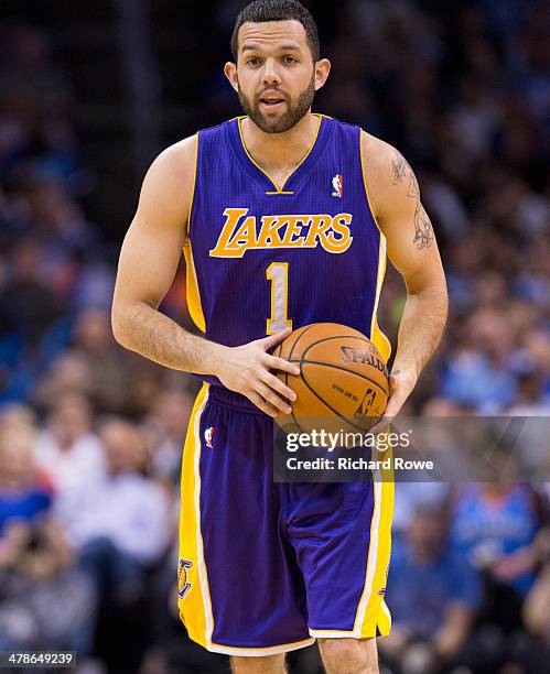 March 13: Jordan Farmar of the Los Angeles Lakers dribbles the ball against the Oklahoma City Thunder at the Chesapeake Arena on March 13, 2014 in...