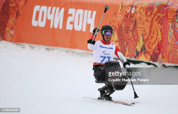 Josh Dueck of Canada celebrates in the Men's Super Combined Sitting Super G on day seven of the Sochi 2014 Paralympic Winter Games at Rosa Khutor...