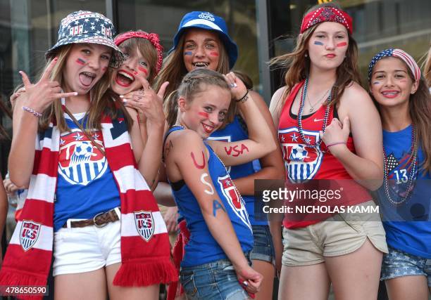 Young USA fans pose before a 2015 FIFA Women's World Cup quarterfinal match against China at Lansdowne Stadium in Ottawa, Ontario on June 26, 2015....