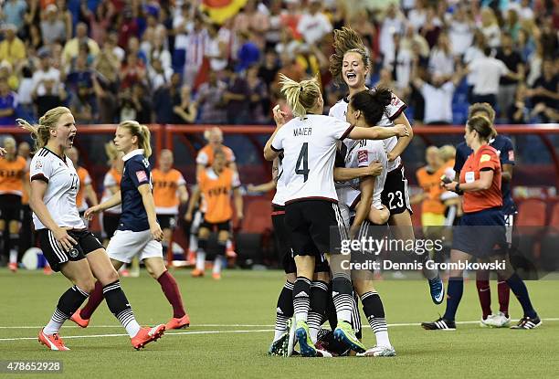 Celia Sasic of Germany celebrates with team mates as she scores their first goal from a penalty during the FIFA Women's World Cup Canada 2015 Quarter...