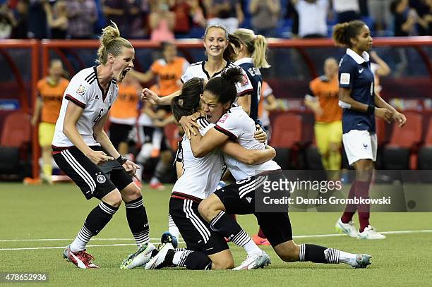 Celia Sasic of Germany celebrates with team mates as she scores their first goal from a penalty during the FIFA Women's World Cup Canada 2015 Quarter...