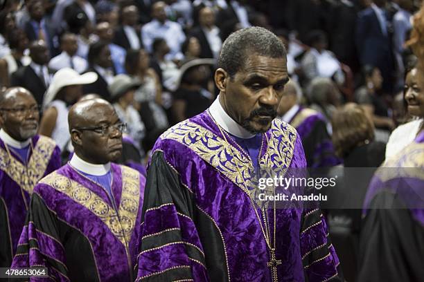 Mourners gather at the College of Charleston TD Arena during the memorial service for Reverend Clementa Pinckney in Charleston, USA on June 26, 2015....