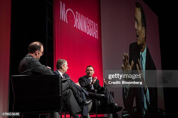 Douglas Hodge, chief investment officer of Pacific Investment Management Co. , right, speaks during a panel discussion with Daniel Ivascyn, chief...