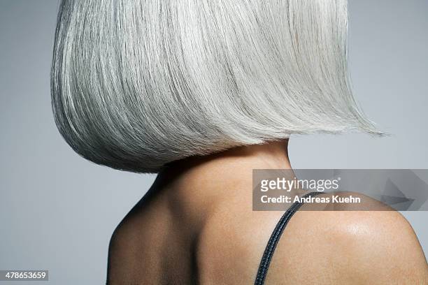 profile of a grey haired woman in a bob, cropped. - stile di capelli foto e immagini stock